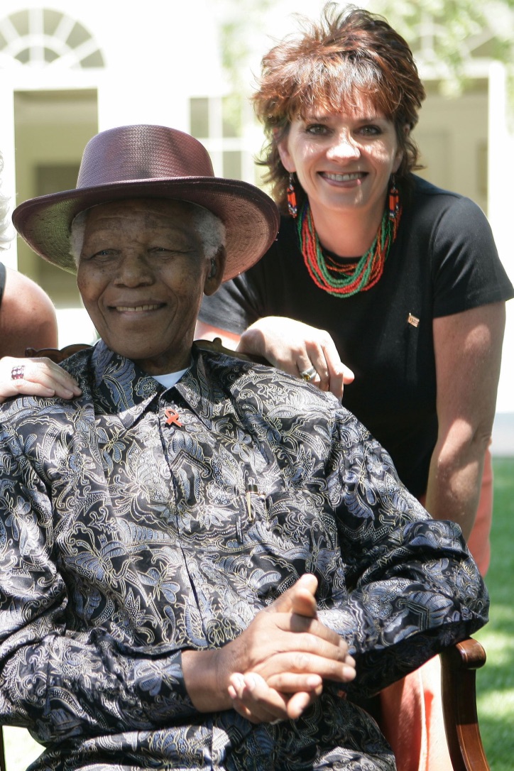 Madiba relaxed and happy, surrounded by children and music.