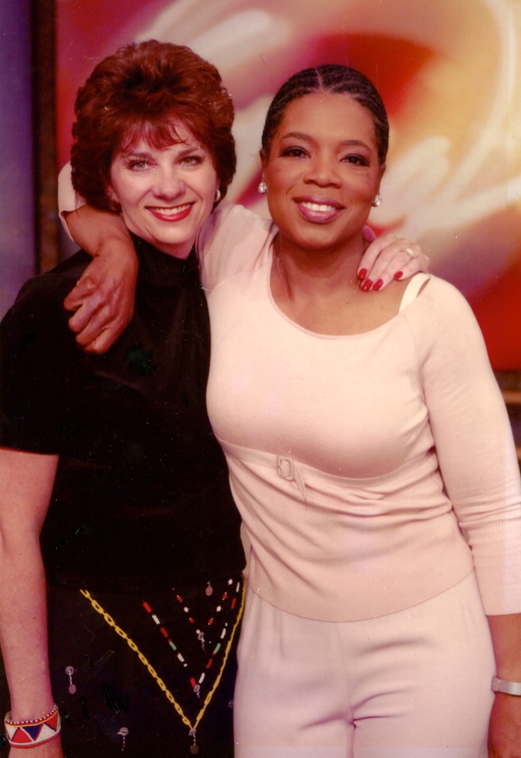 With Oprah.